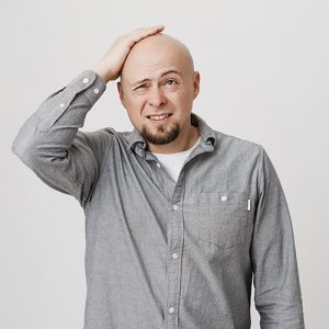 A bald man with facial expression